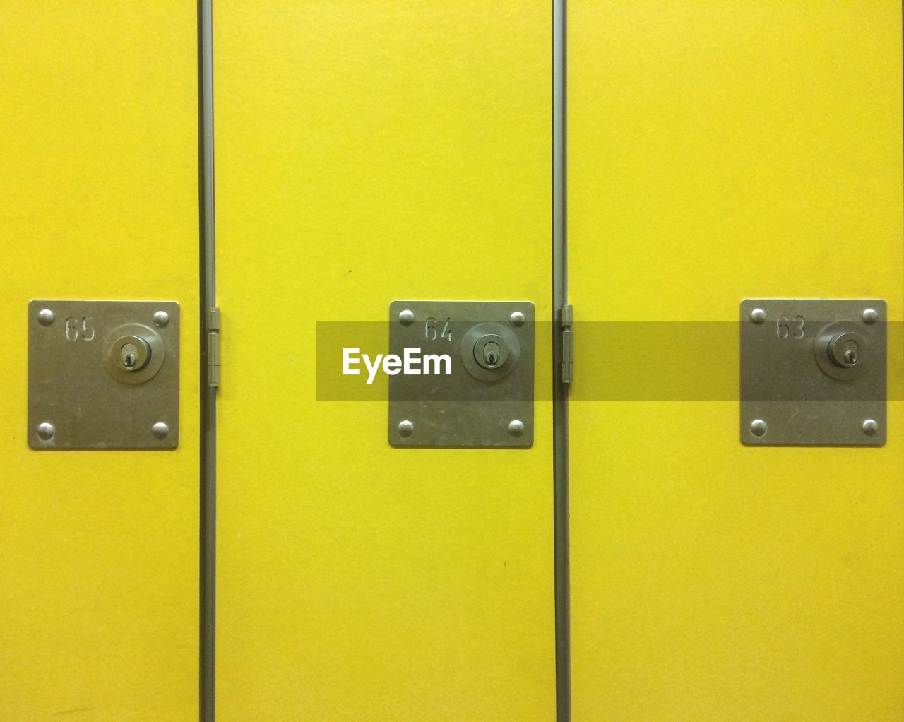 Full frame shot of closed yellow lockers