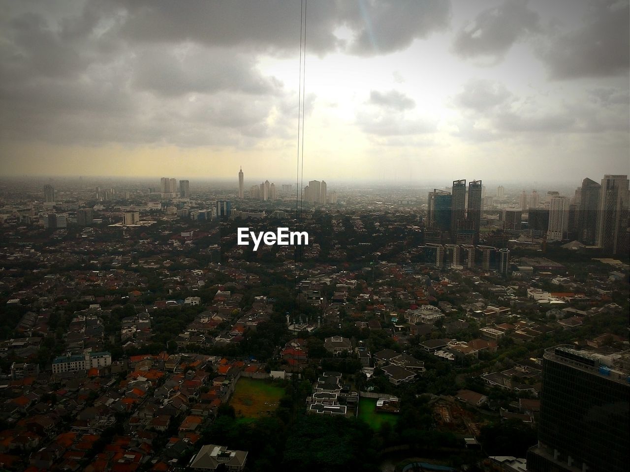 CITYSCAPE AGAINST CLOUDY SKY