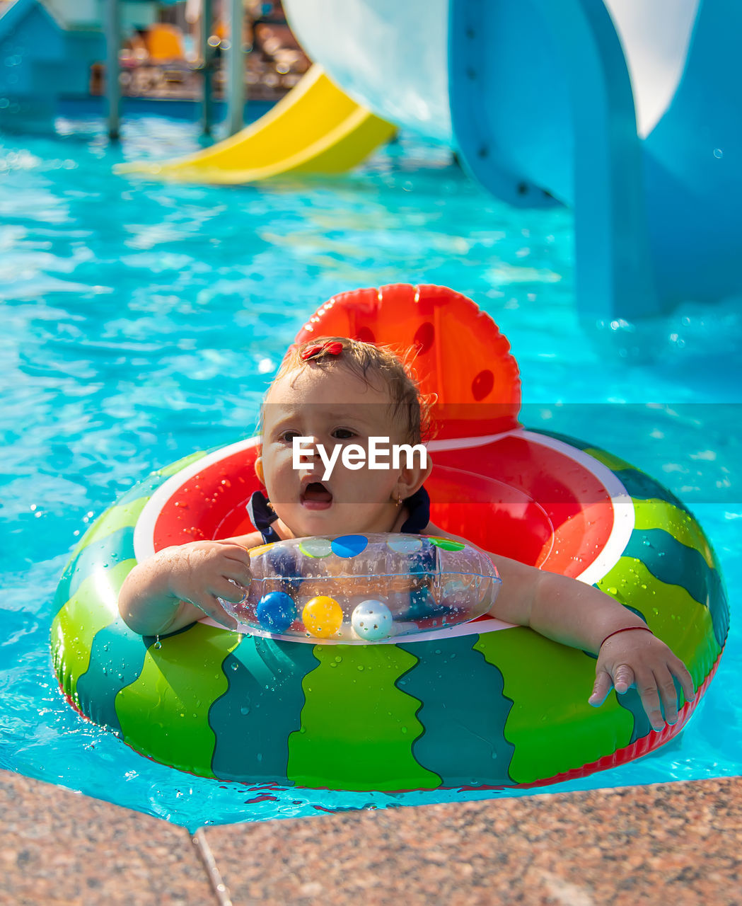high angle view of boy playing in swimming pool