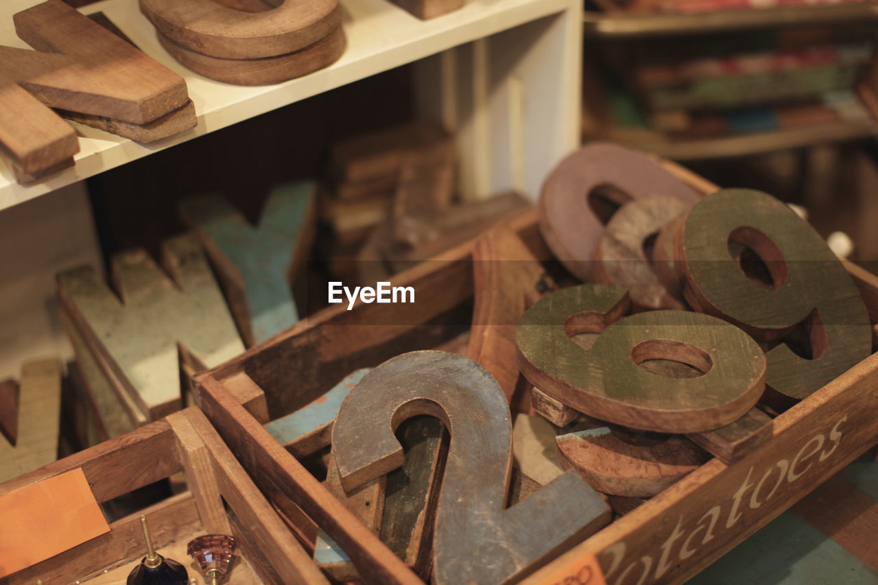 High angle view of wooden numbers and alphabets