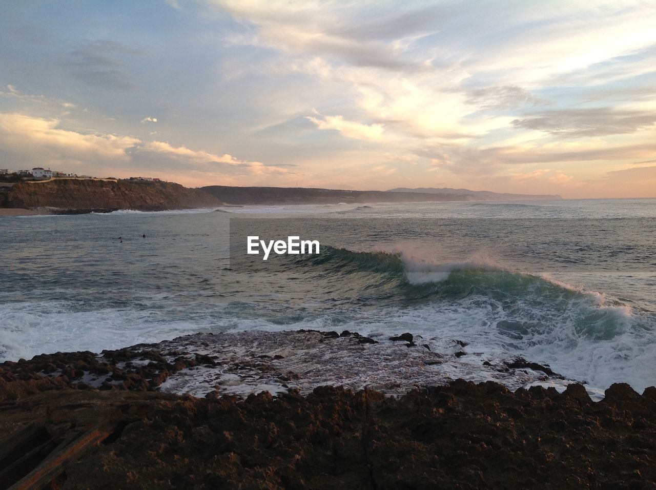 Scenic view of sea against dramatic sky