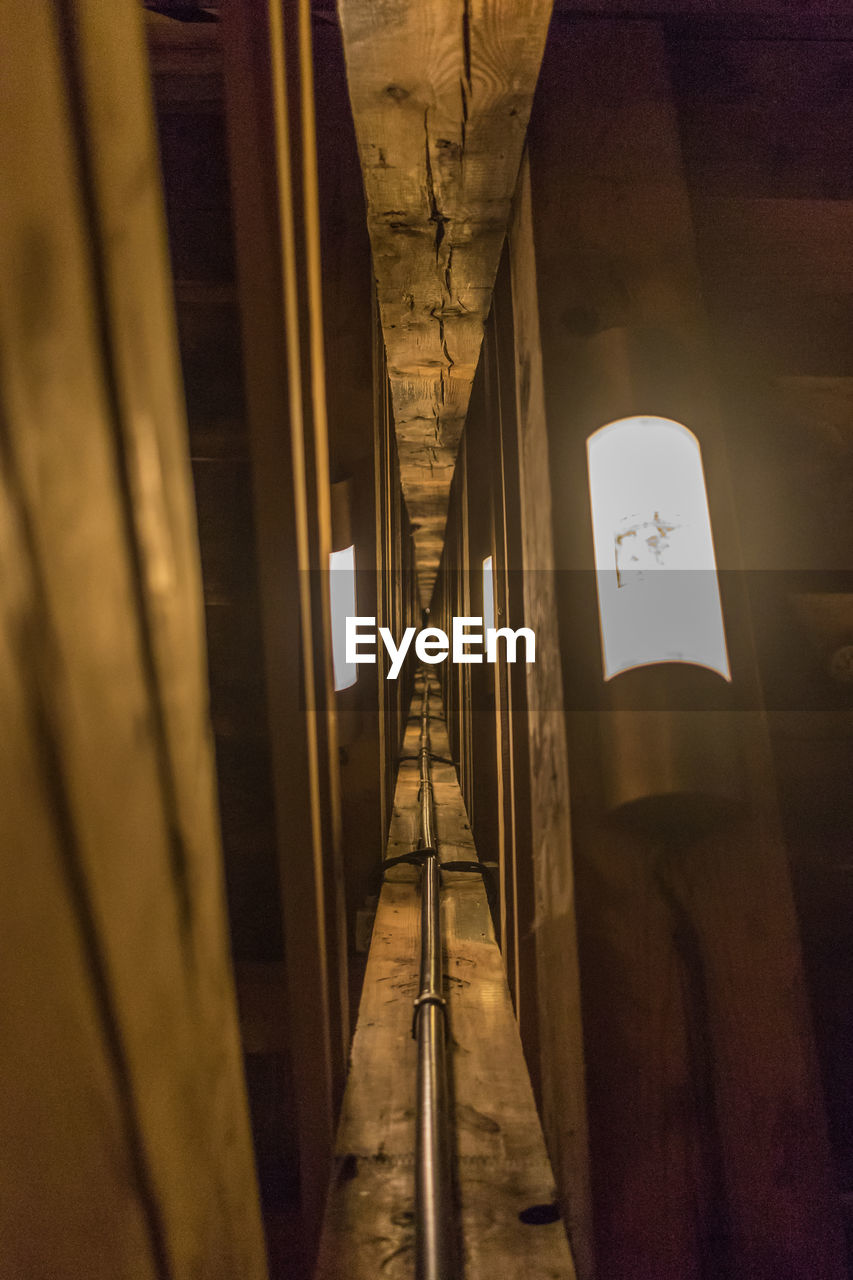 VIEW OF ILLUMINATED CORRIDOR OF BUILDING