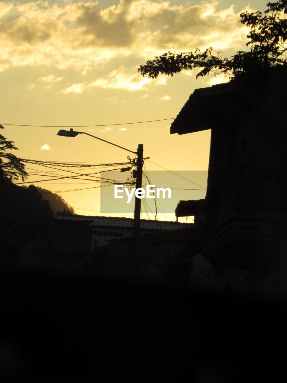 SILHOUETTE BUILT STRUCTURES AT SUNSET