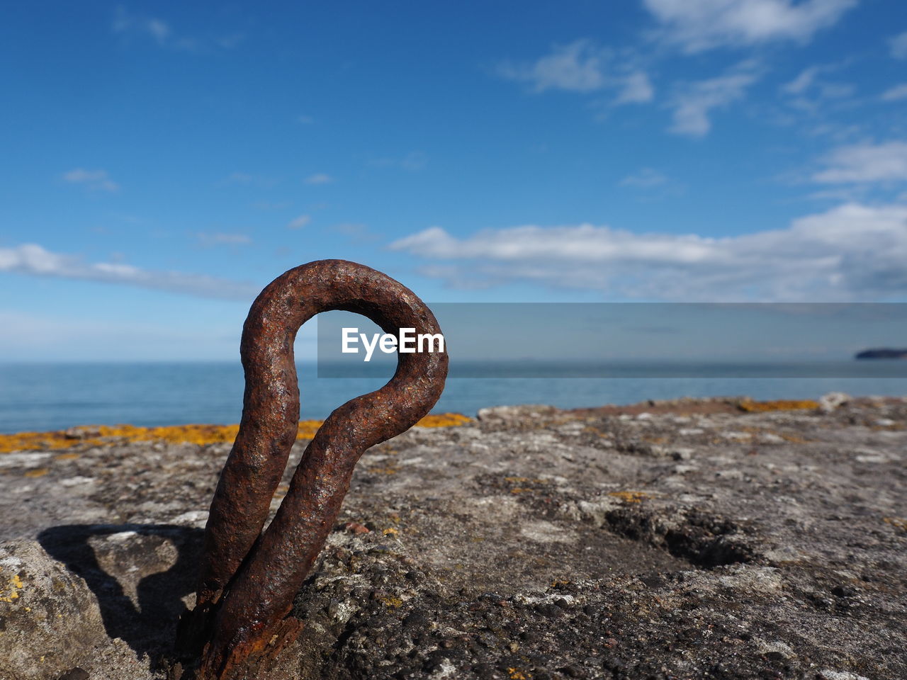 sea, water, rock, sky, ocean, rusty, coast, nature, shore, metal, beach, no people, land, cloud, sand, day, horizon, horizon over water, outdoors, tranquility, body of water, scenics - nature, blue