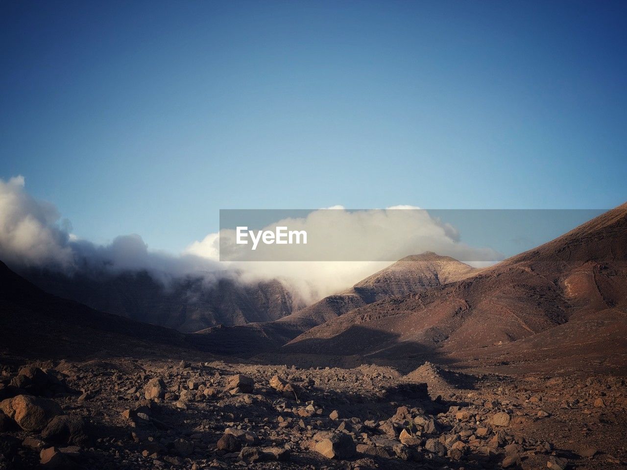 landscape, environment, sky, mountain, cloud, scenics - nature, nature, beauty in nature, land, no people, wilderness, blue, morning, mountain range, travel, travel destinations, non-urban scene, sunlight, dawn, outdoors, horizon, geology, tranquility, volcano, plateau, desert, day, valley, rock, tranquil scene