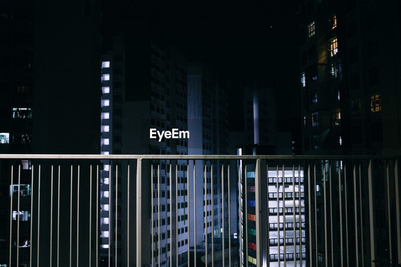 Illuminated buildings in city at night