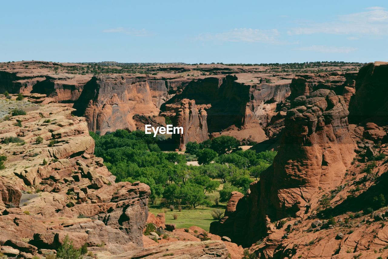 High angle view of rocky cliffs at canyon de chelly against sky