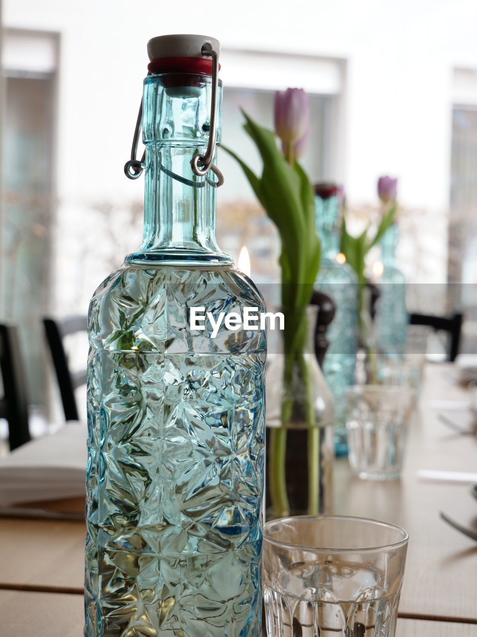 Close-up of glass bottle on table