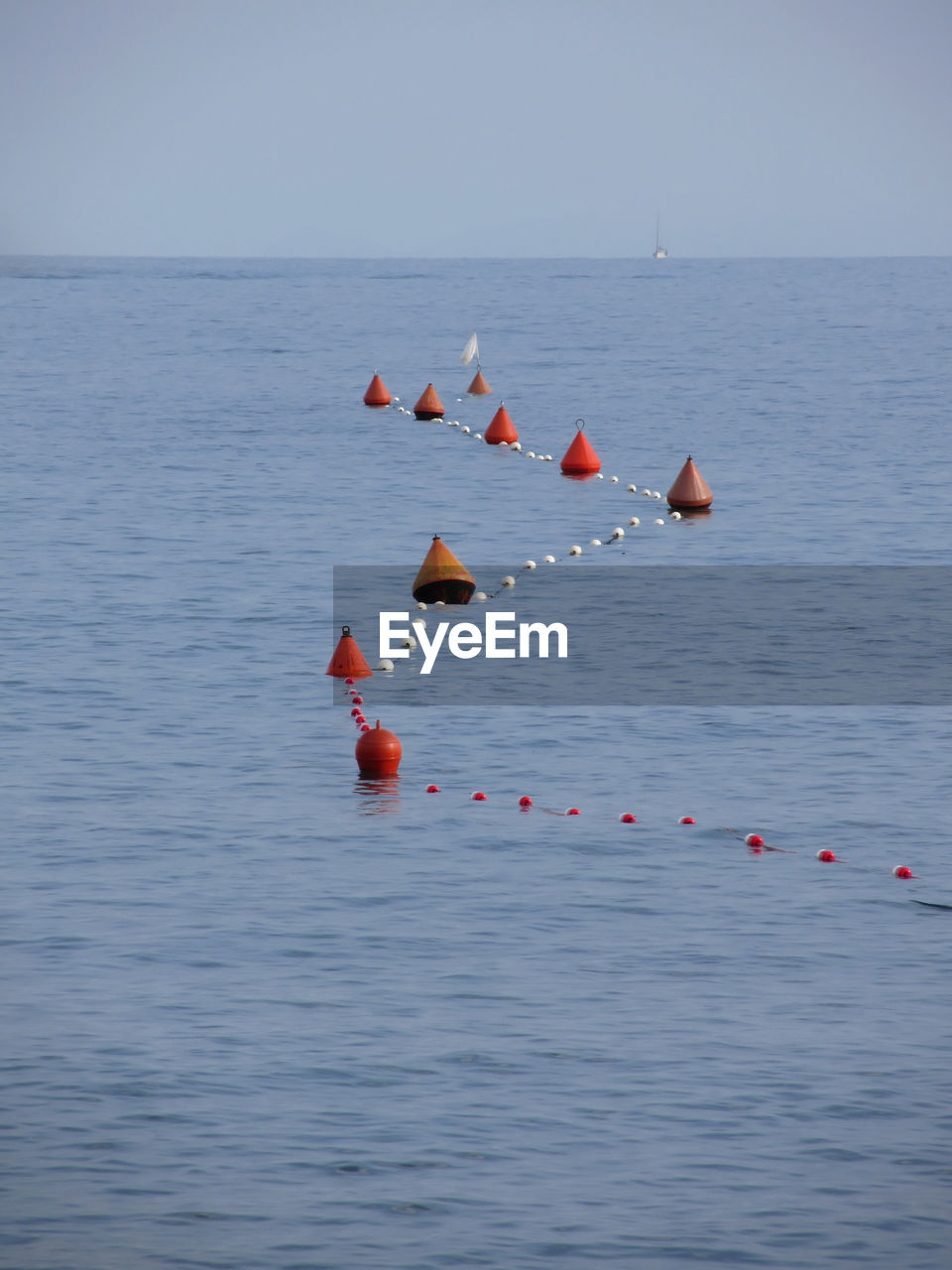 Buoy with rope floating in sea