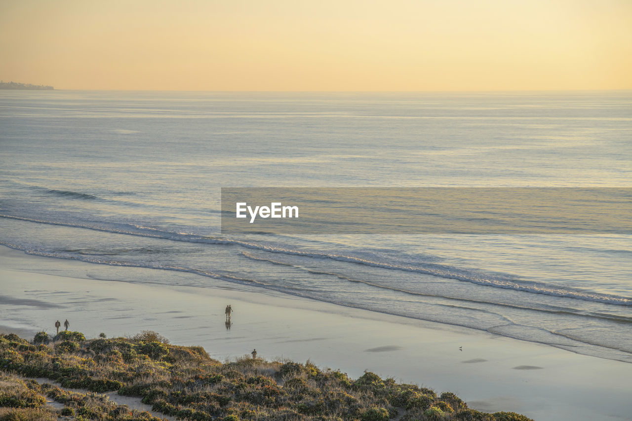 scenic view of beach during sunset