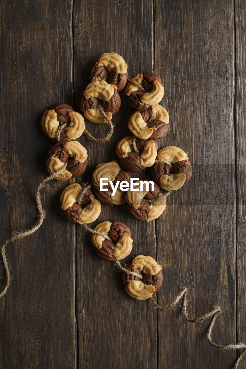 food and drink, food, wood, freshness, healthy eating, wellbeing, indoors, large group of objects, nut - food, nut, studio shot, still life, no people, table, produce, directly above, brown, high angle view, abundance, fruit, walnut, spice, dried food, ingredient, close-up, rustic, dried fruit