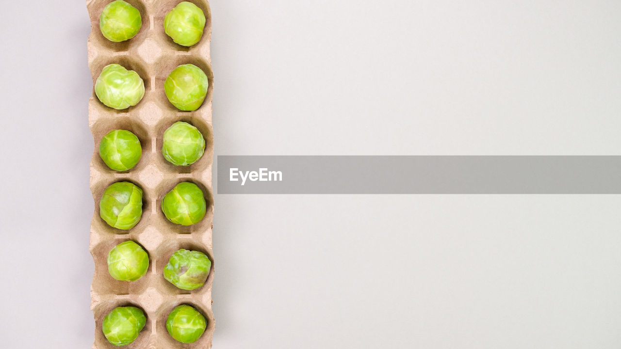 green, studio shot, food, food and drink, healthy eating, indoors, copy space, wellbeing, freshness, no people, produce, vegetable, fruit, white background, plant, cut out, in a row, still life, yellow, close-up, directly above, large group of objects, arrangement, cucumber