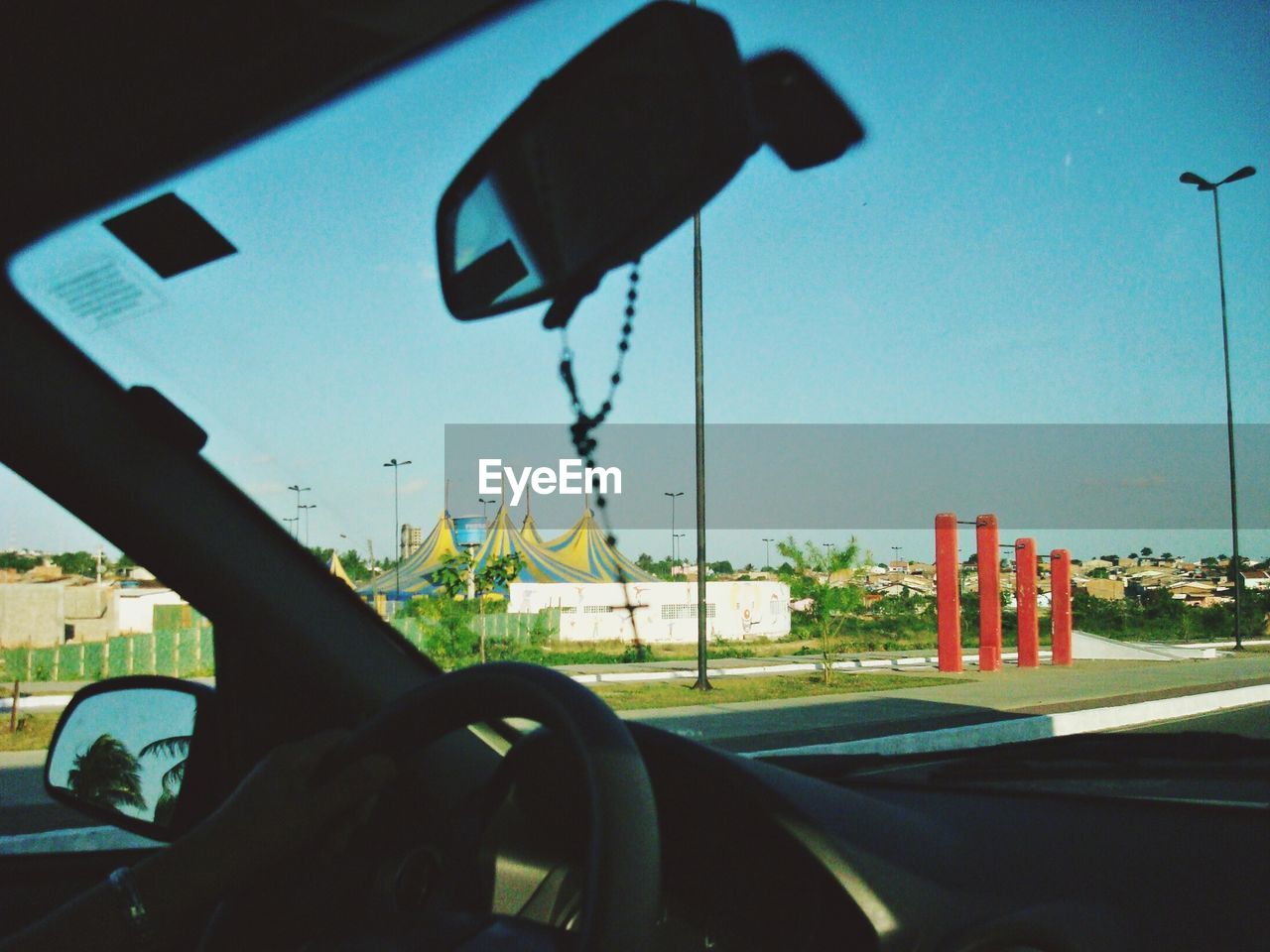 CLOSE-UP OF ROAD SIGN ON CAR