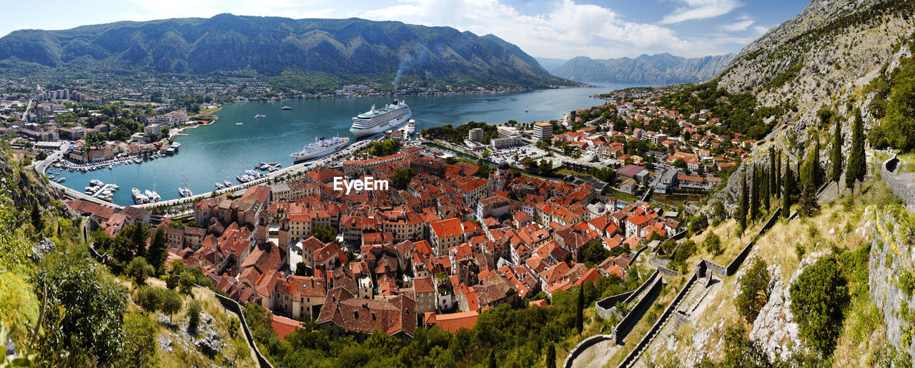 High angle view of townscape by sea