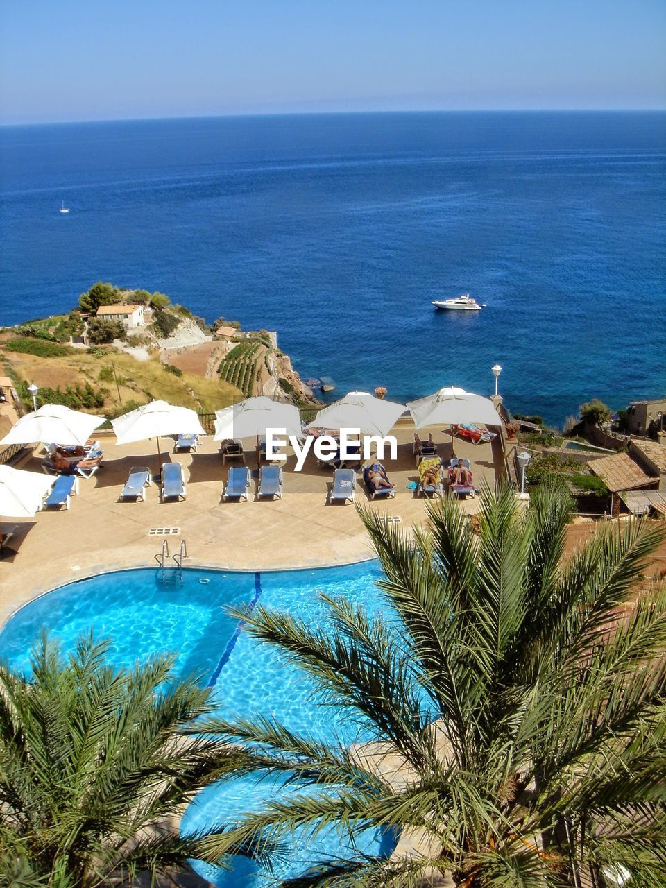 High angle view of swimming pool by sea against sky