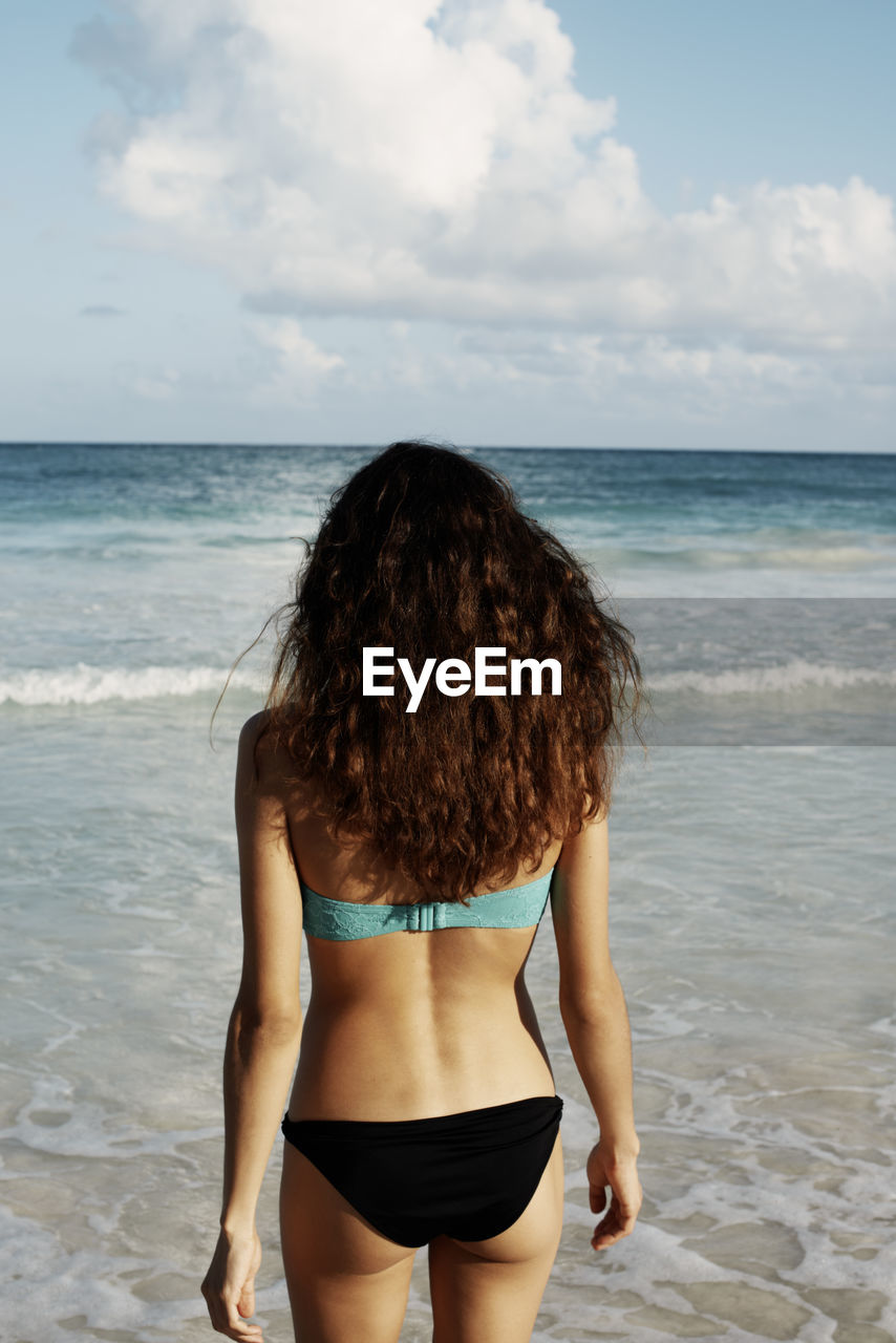 Young woman in bikini on beach