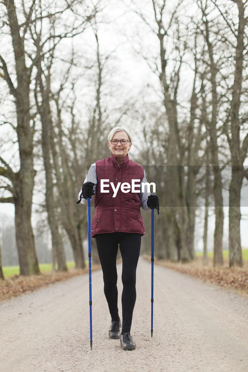 Senior woman with walking poles