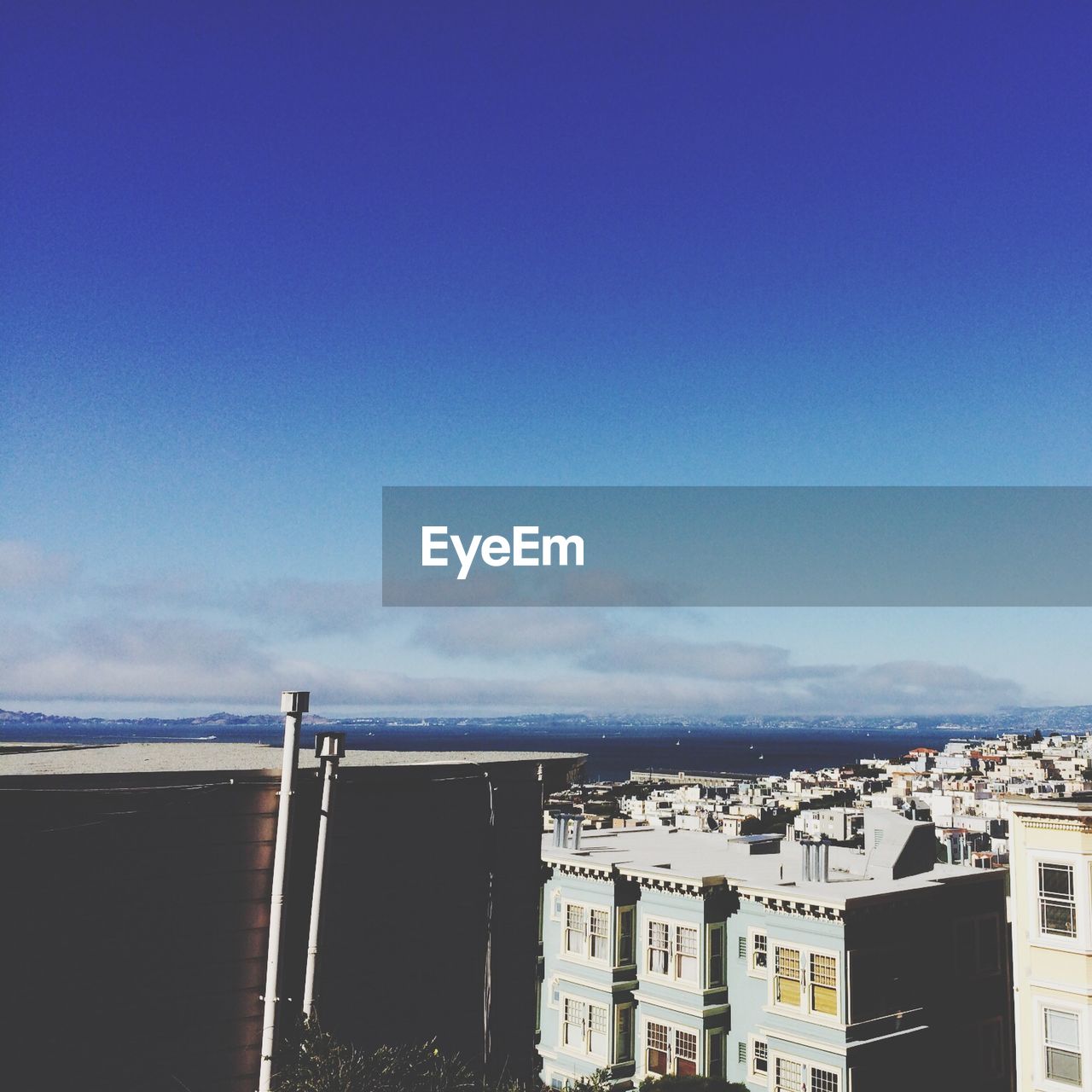 Residential buildings against blue sky