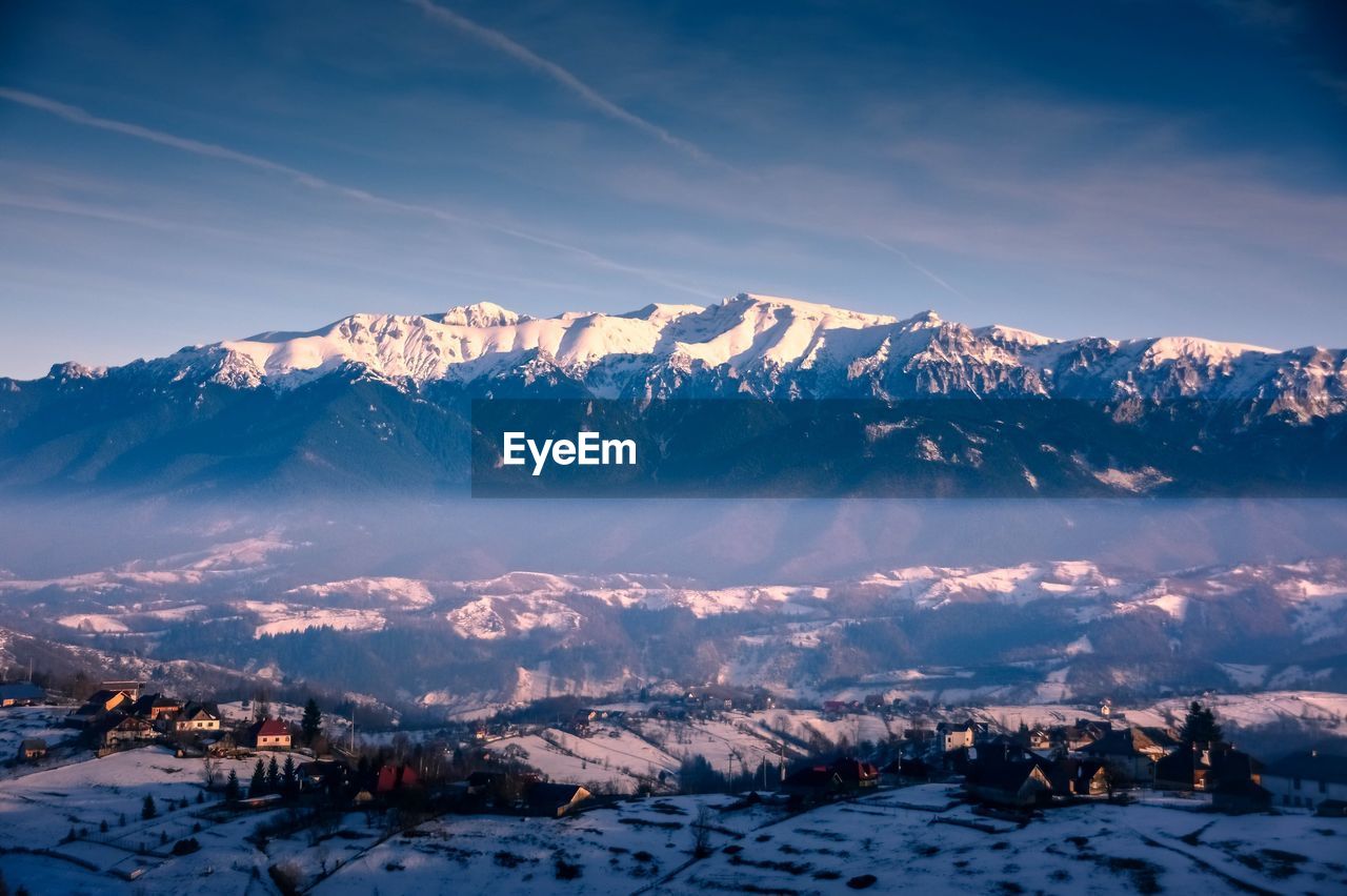 Scenic view of snowcapped mountains against sky