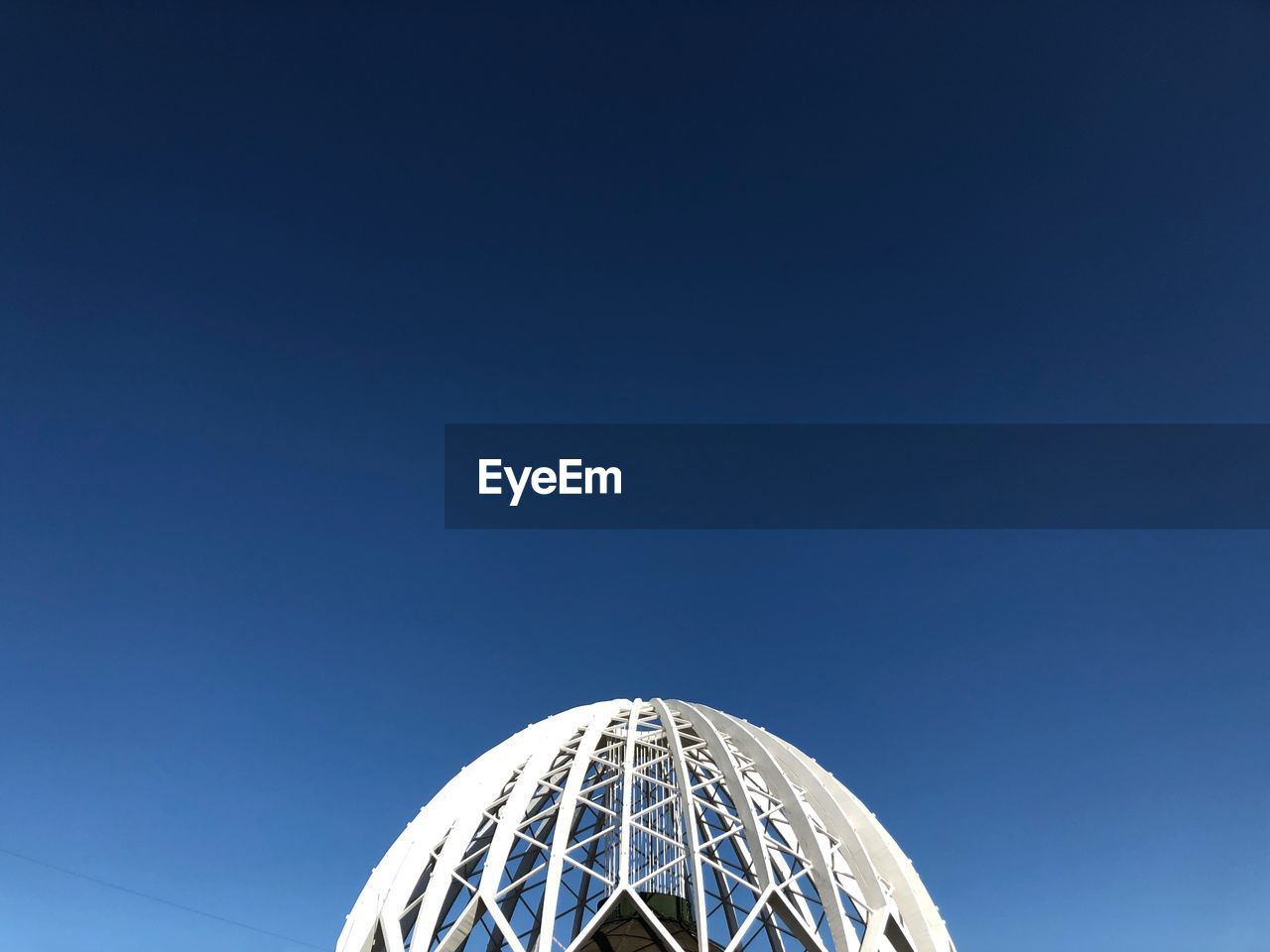 LOW ANGLE VIEW OF FERRIS WHEEL AGAINST SKY