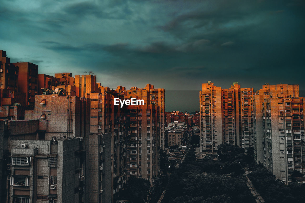 Cityscape against sky at dusk