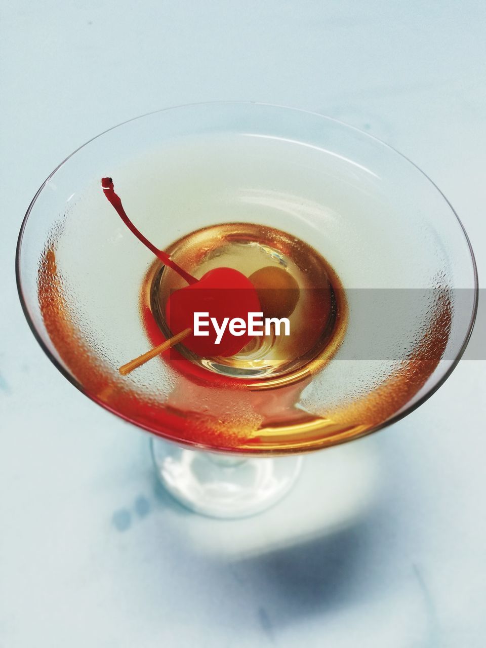 HIGH ANGLE VIEW OF TEA ON GLASS TABLE