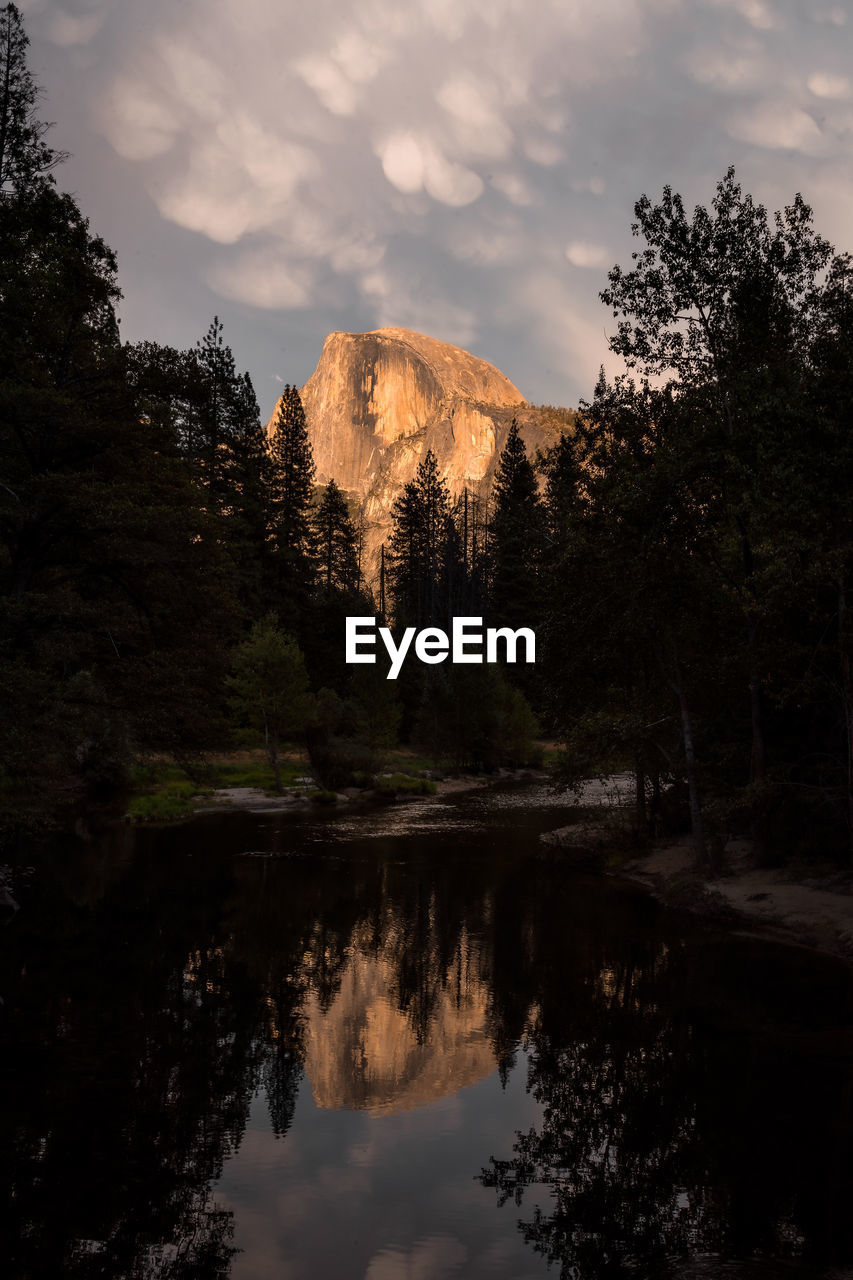 Half dome and unique cloud formations for sunset in yosemite national park - california