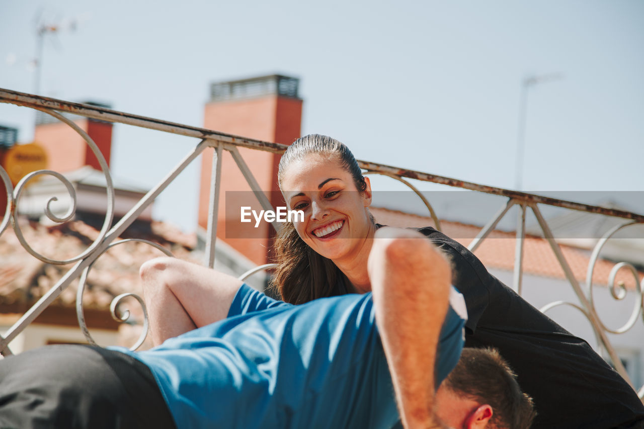 A couple exercising on their rooftop