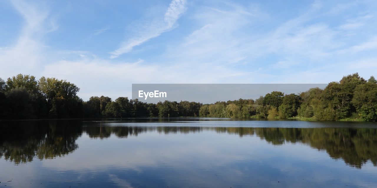 reflection, water, tree, lake, sky, plant, nature, tranquility, beauty in nature, body of water, scenics - nature, tranquil scene, cloud, reservoir, no people, forest, environment, landscape, non-urban scene, blue, outdoors, travel destinations, day, idyllic, land, morning, summer, woodland