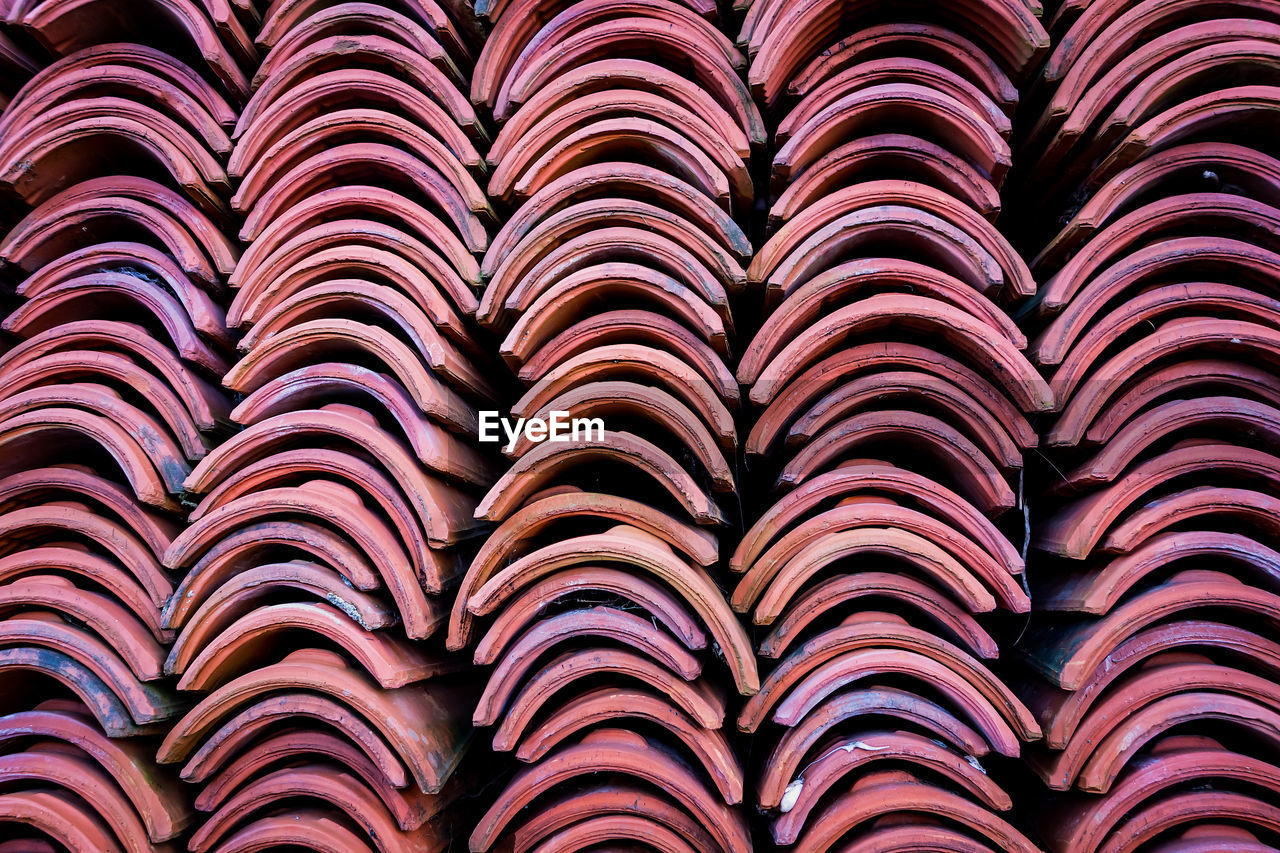 FULL FRAME SHOT OF ROOF TILES IN ROW