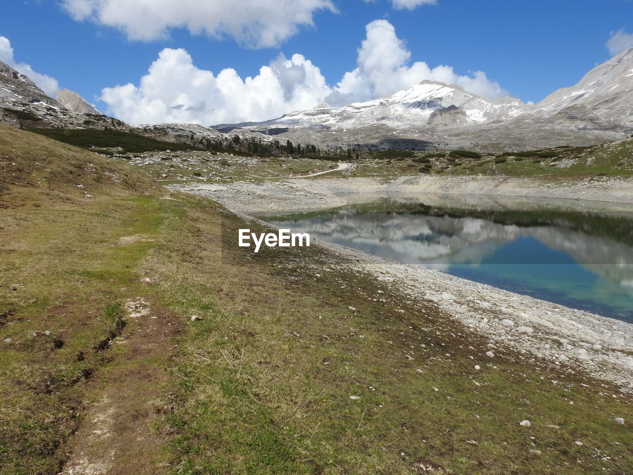 Scenic view of lake and mountains against sky