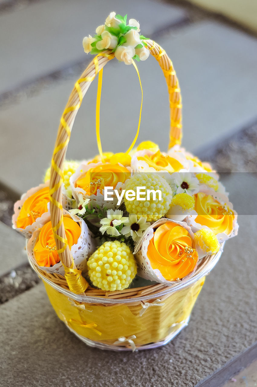 Bouquet of cupcake and marshmallows in basket. a gift on valentines day, birthday and anniversary.