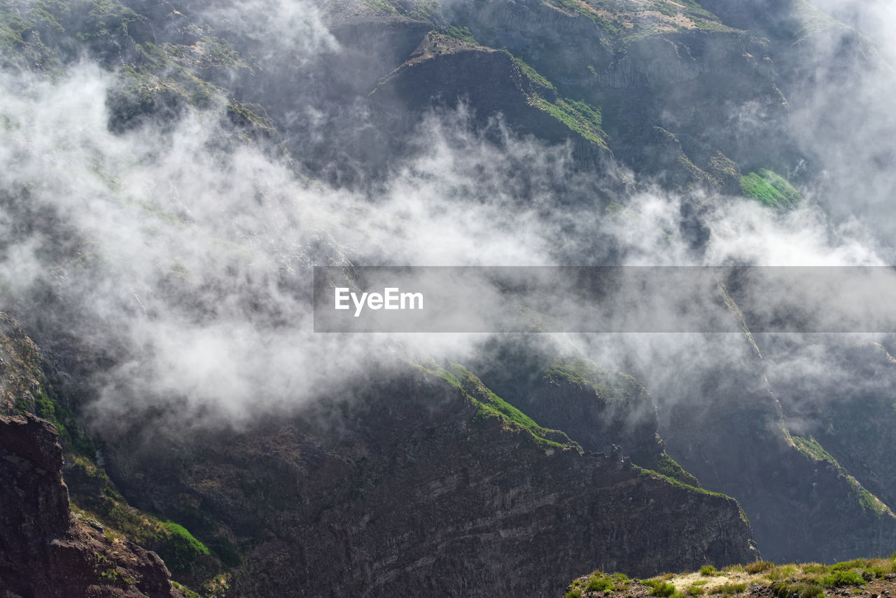 Scenic view of mountain ridge in a clouds