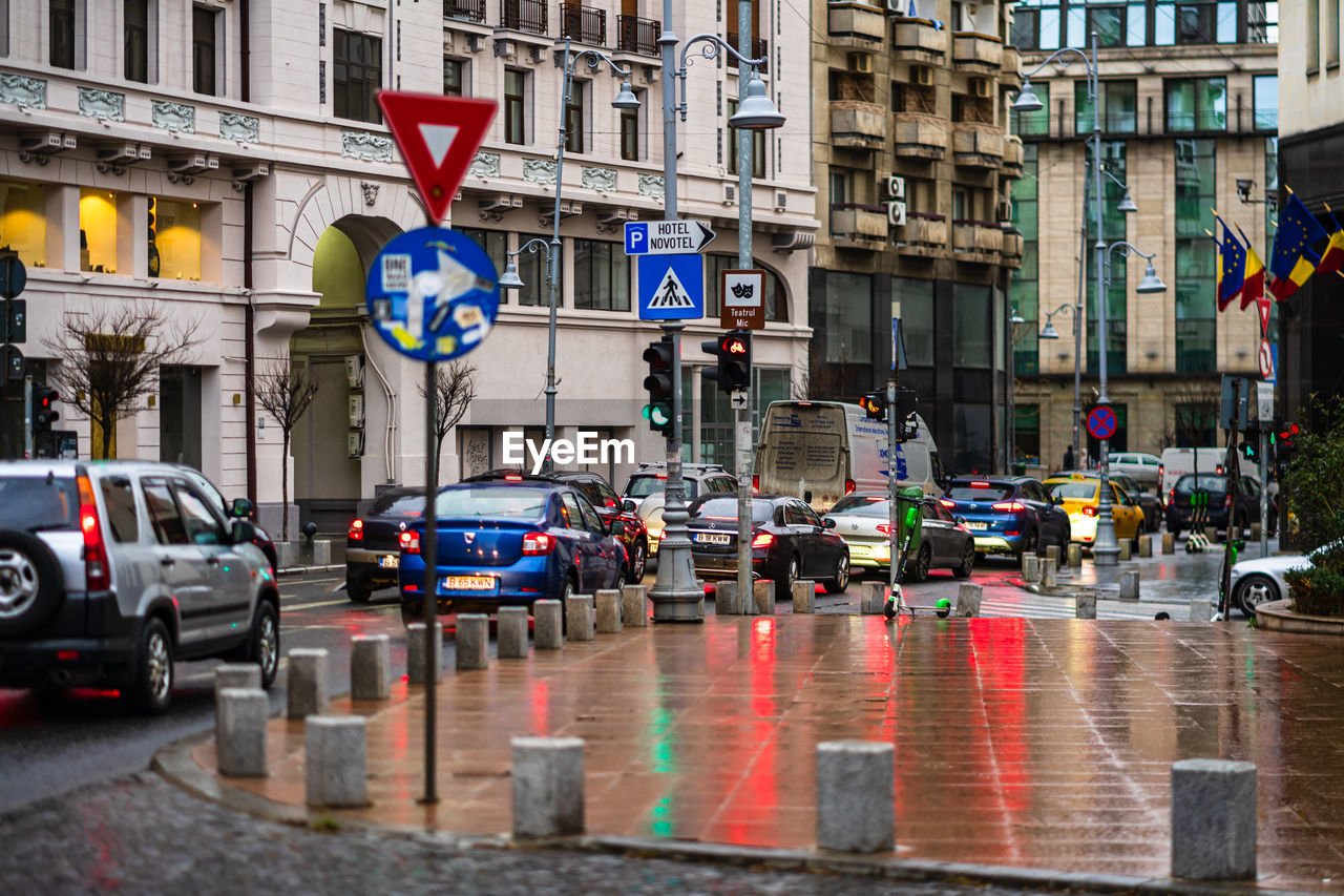 VEHICLES ON ROAD IN CITY