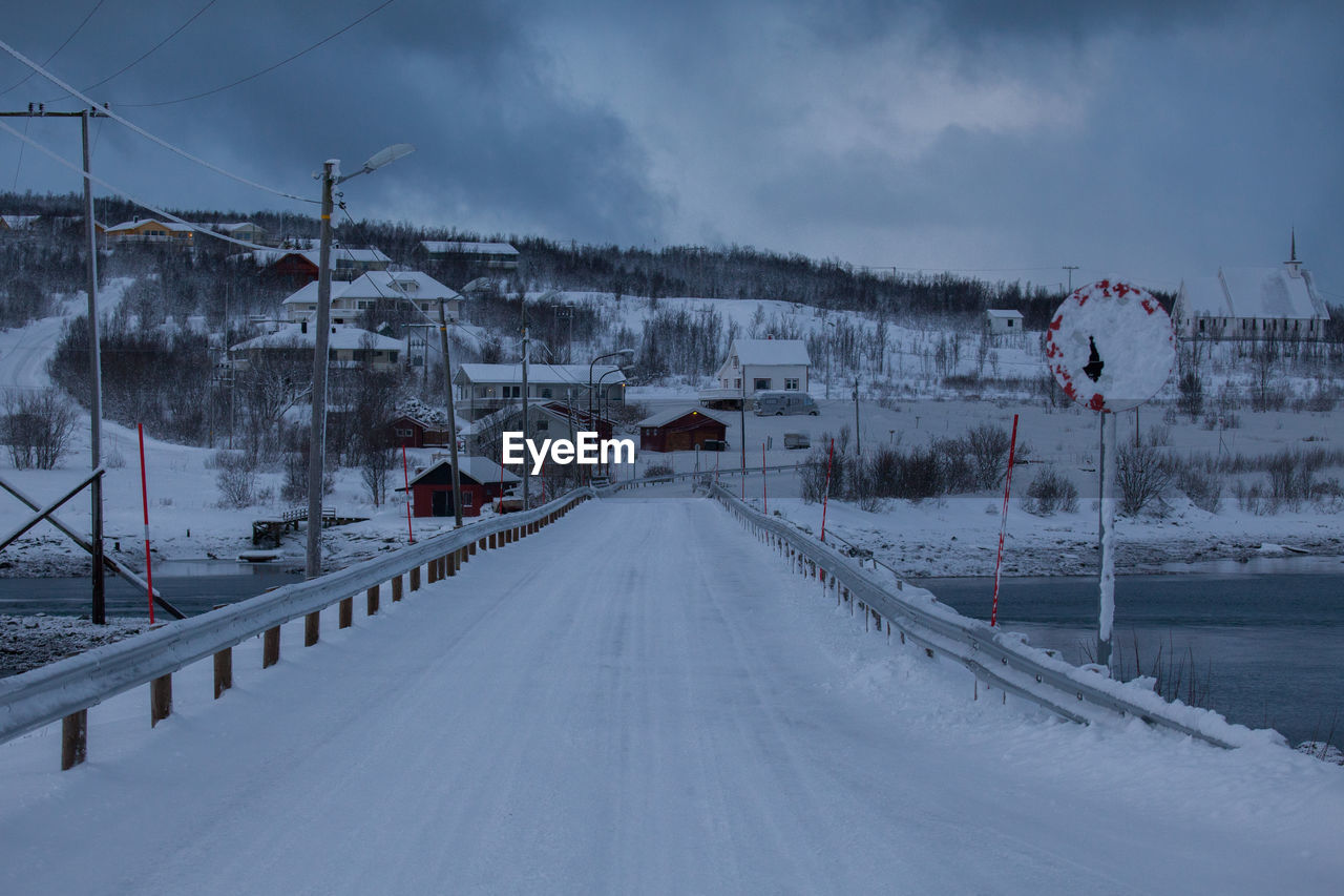 Panoramic view of snow covered mountain against sky