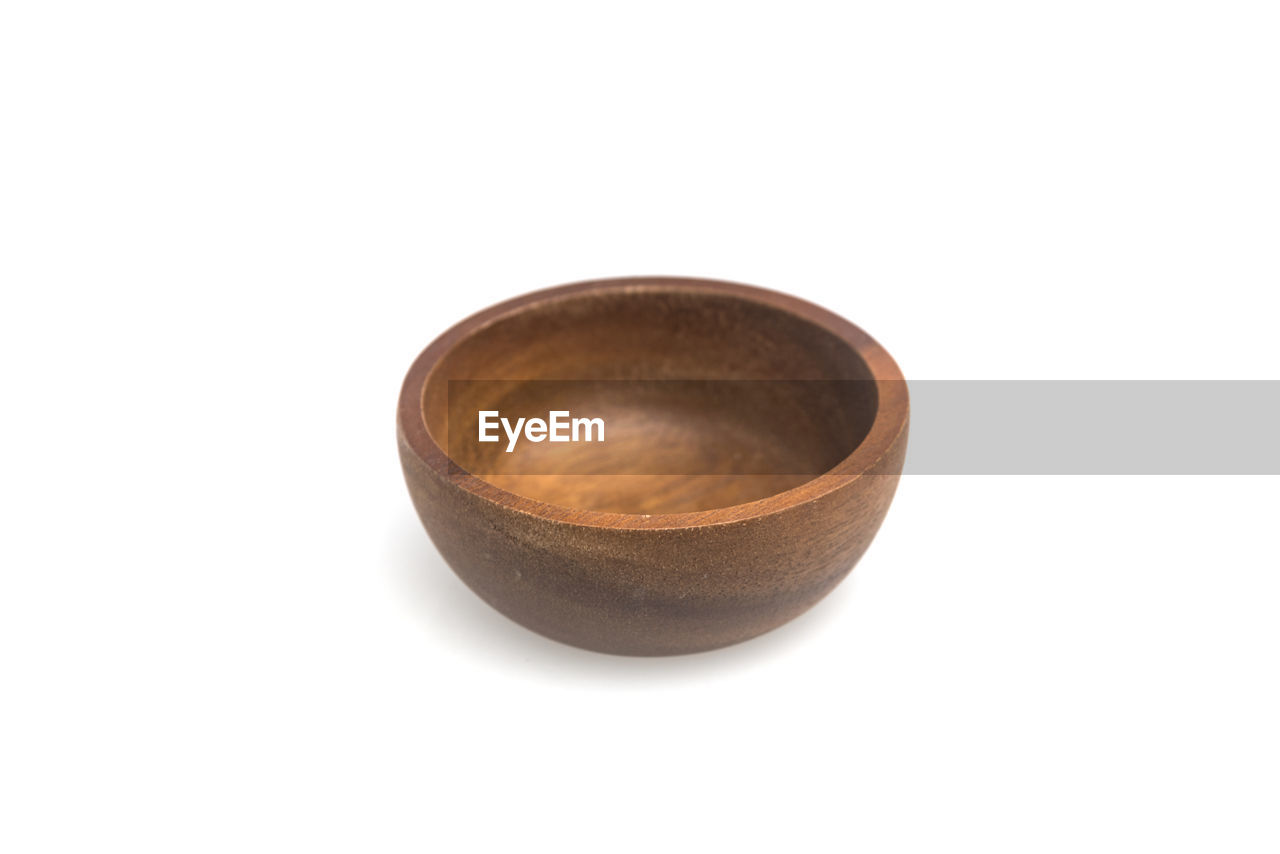 Wooden bowl against white background