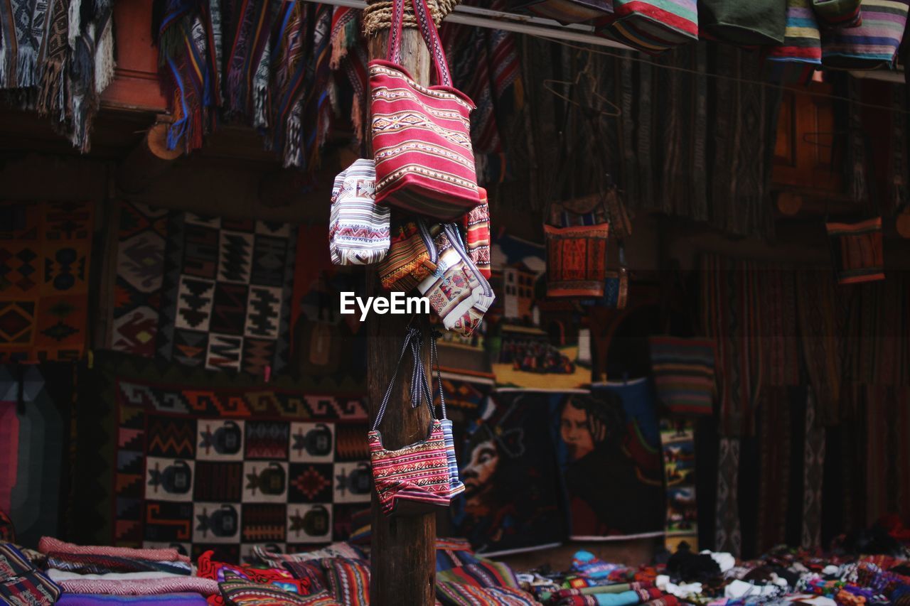 Clothes hanging at market stall for sale