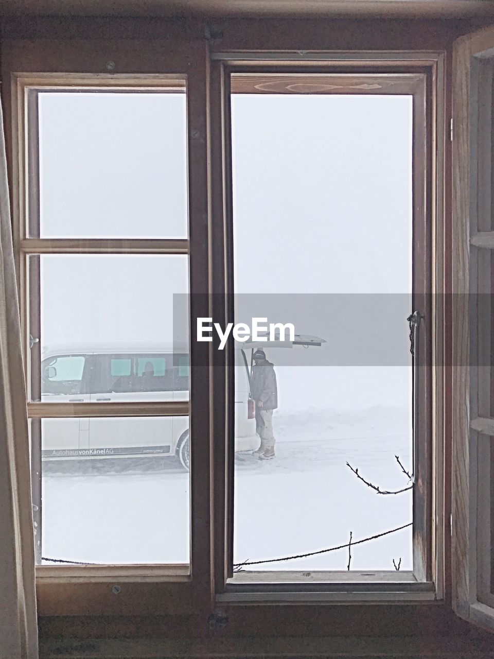 VIEW OF CITYSCAPE SEEN THROUGH WINDOW