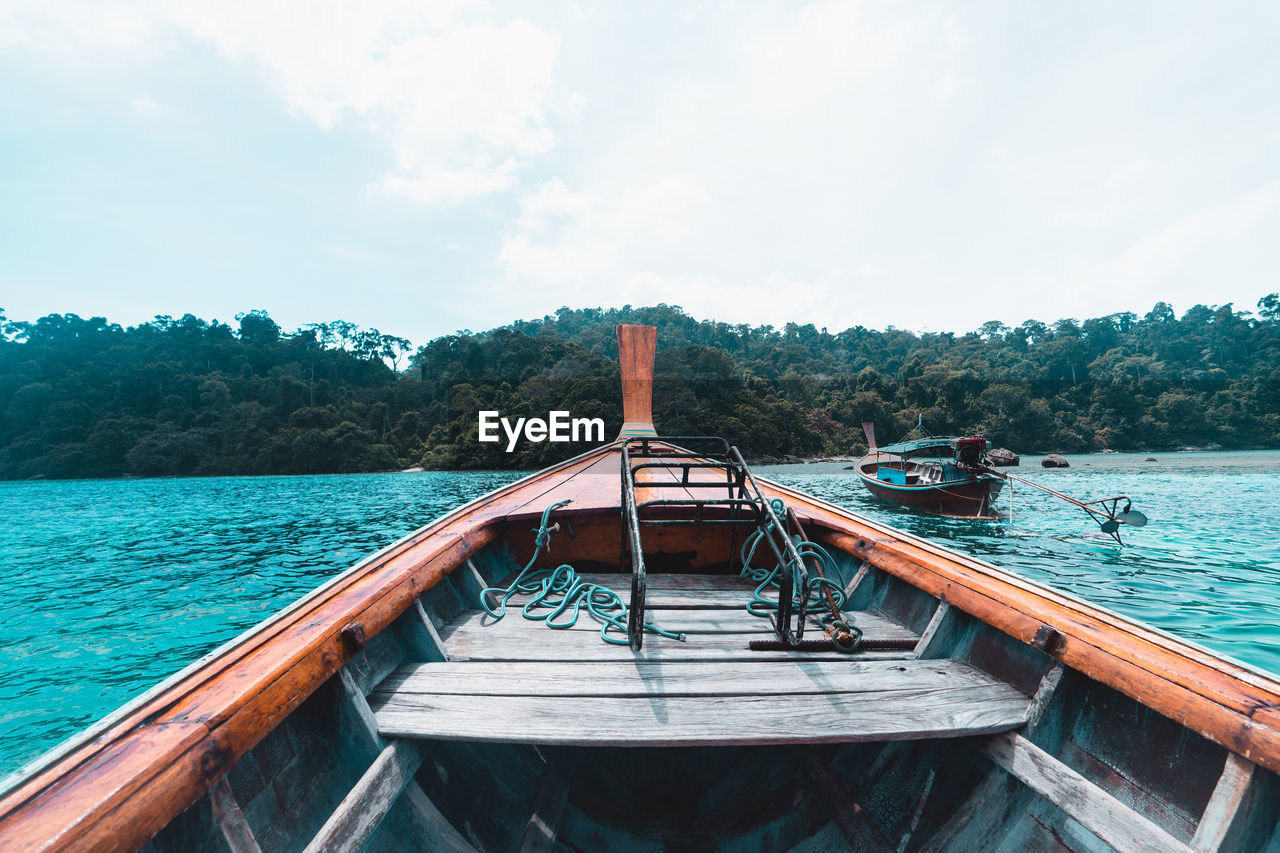 View of boat in sea against sky