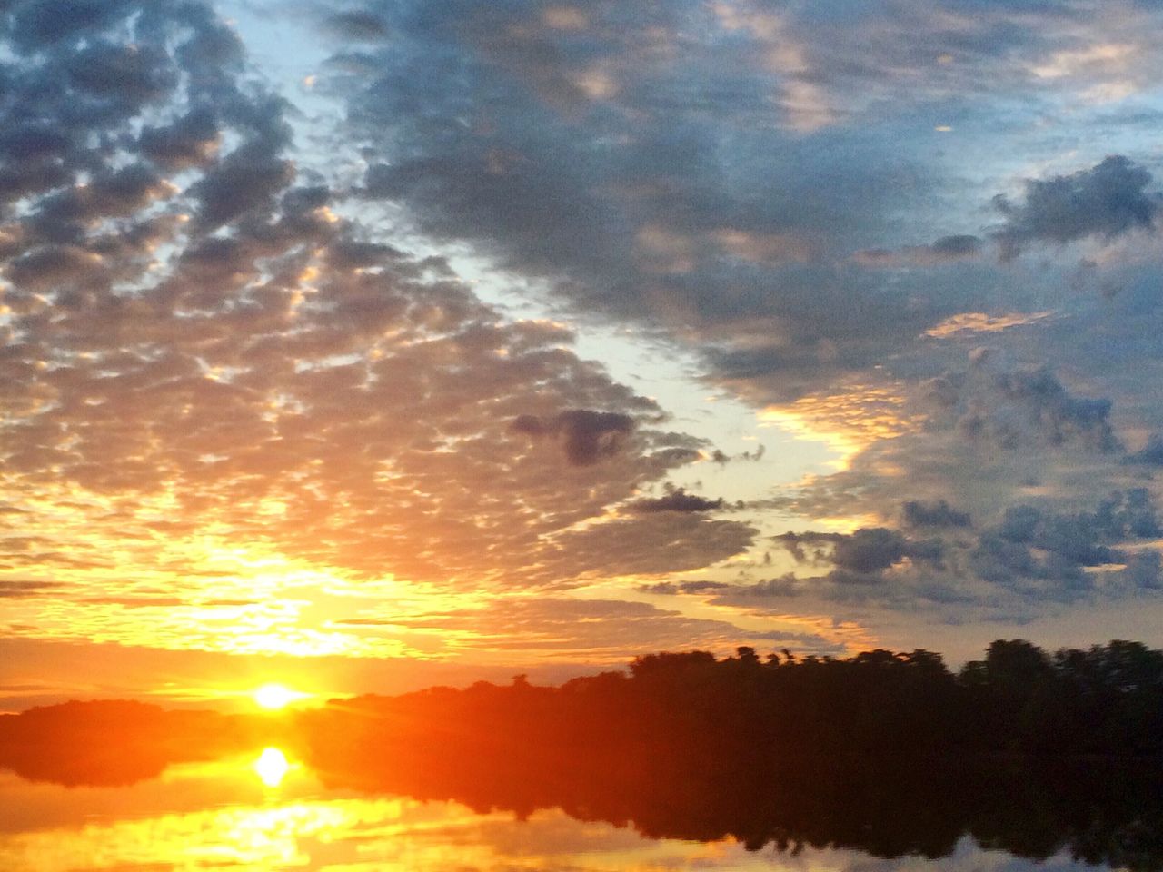 SUNSET OVER CALM SEA