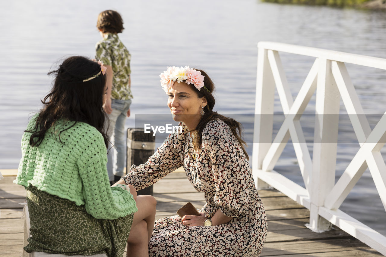 Mother with children on jetty