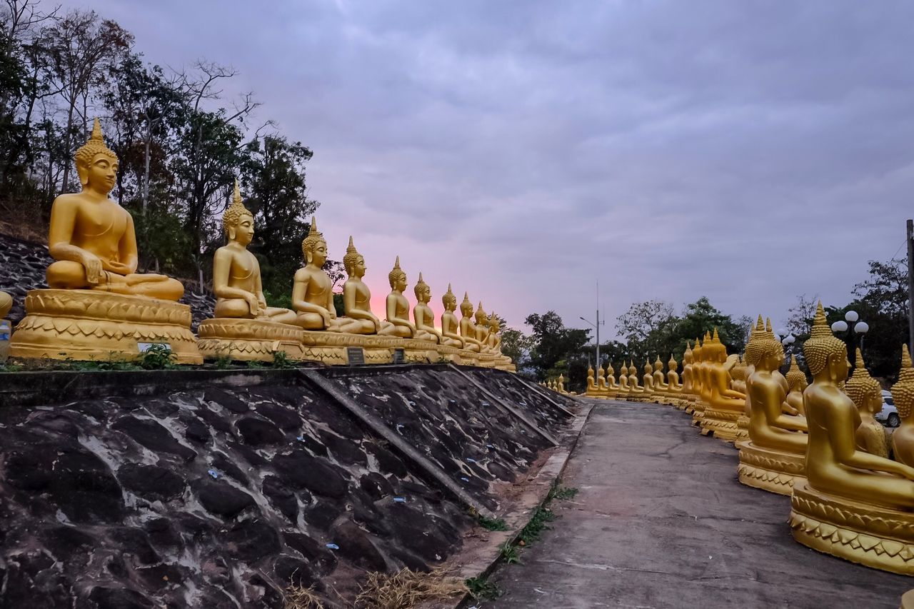 STATUE AGAINST TEMPLE