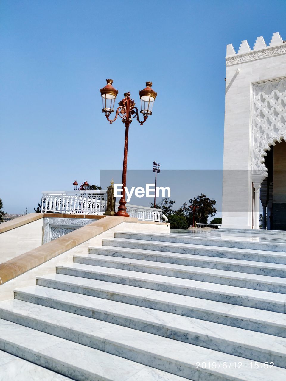 LOW ANGLE VIEW OF STAIRCASE AGAINST BUILDINGS