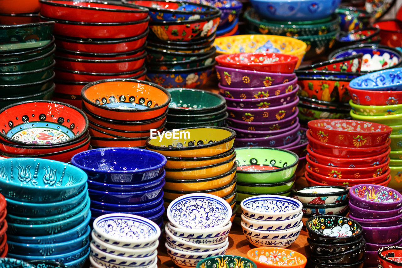 Multi colored bowls for sale at market stall