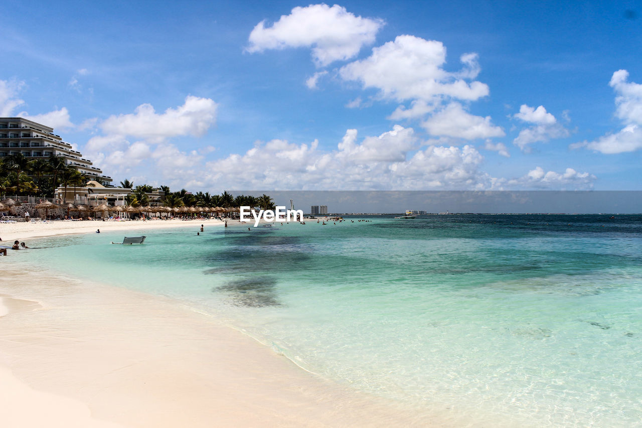 View of beach against cloudy sky