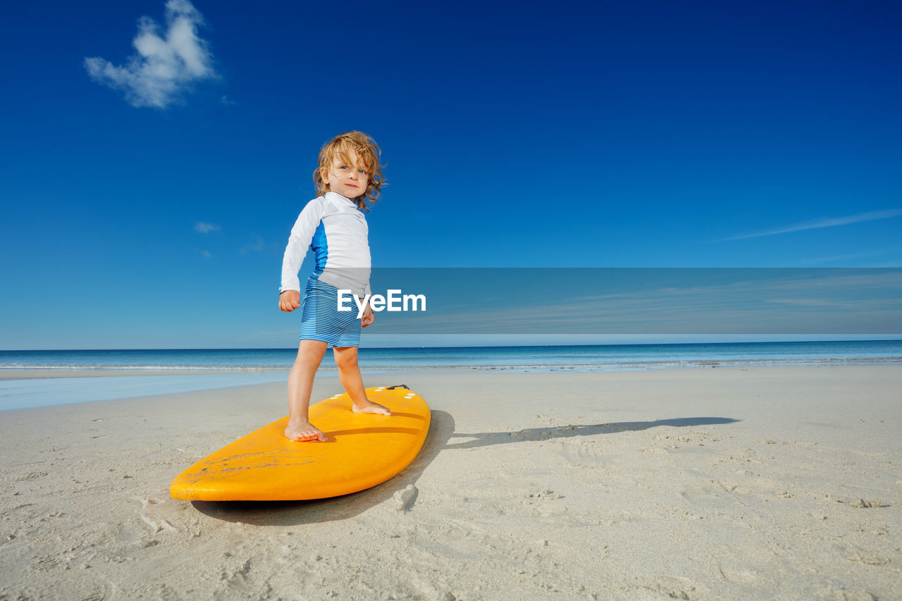 rear view of woman swimming in sea