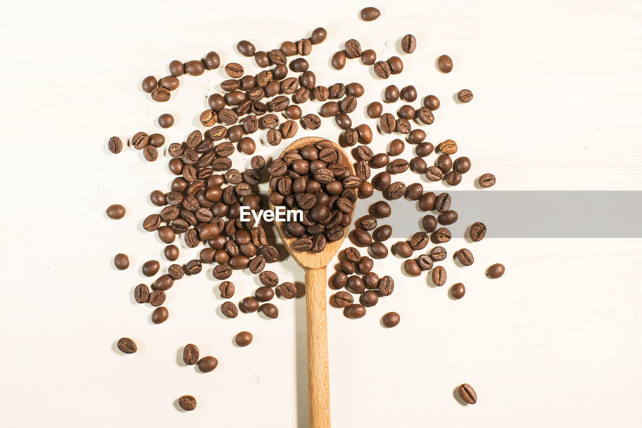 HIGH ANGLE VIEW OF COFFEE BEANS IN GLASS