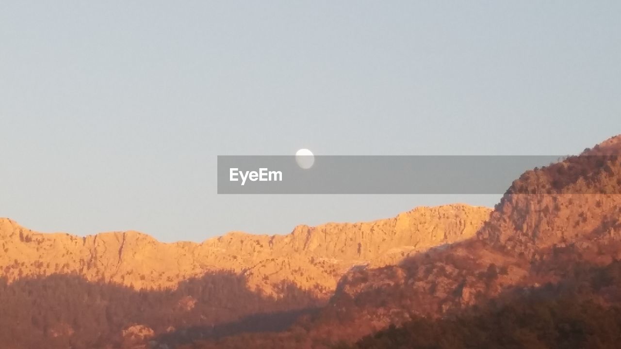 SCENIC VIEW OF MOON AGAINST SKY