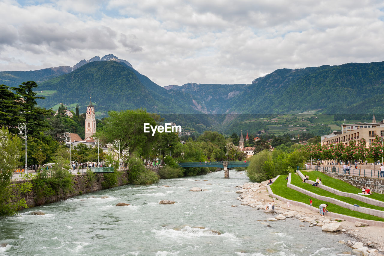 Panoramic view of trees and buildings against sky