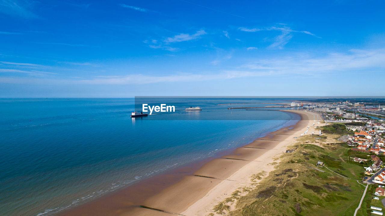 High angle view of sea against blue sky